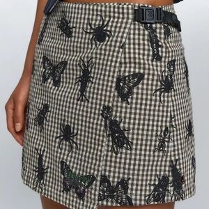 Worship Checker Print Mini Skirt with Insect Motif - Black on Brown